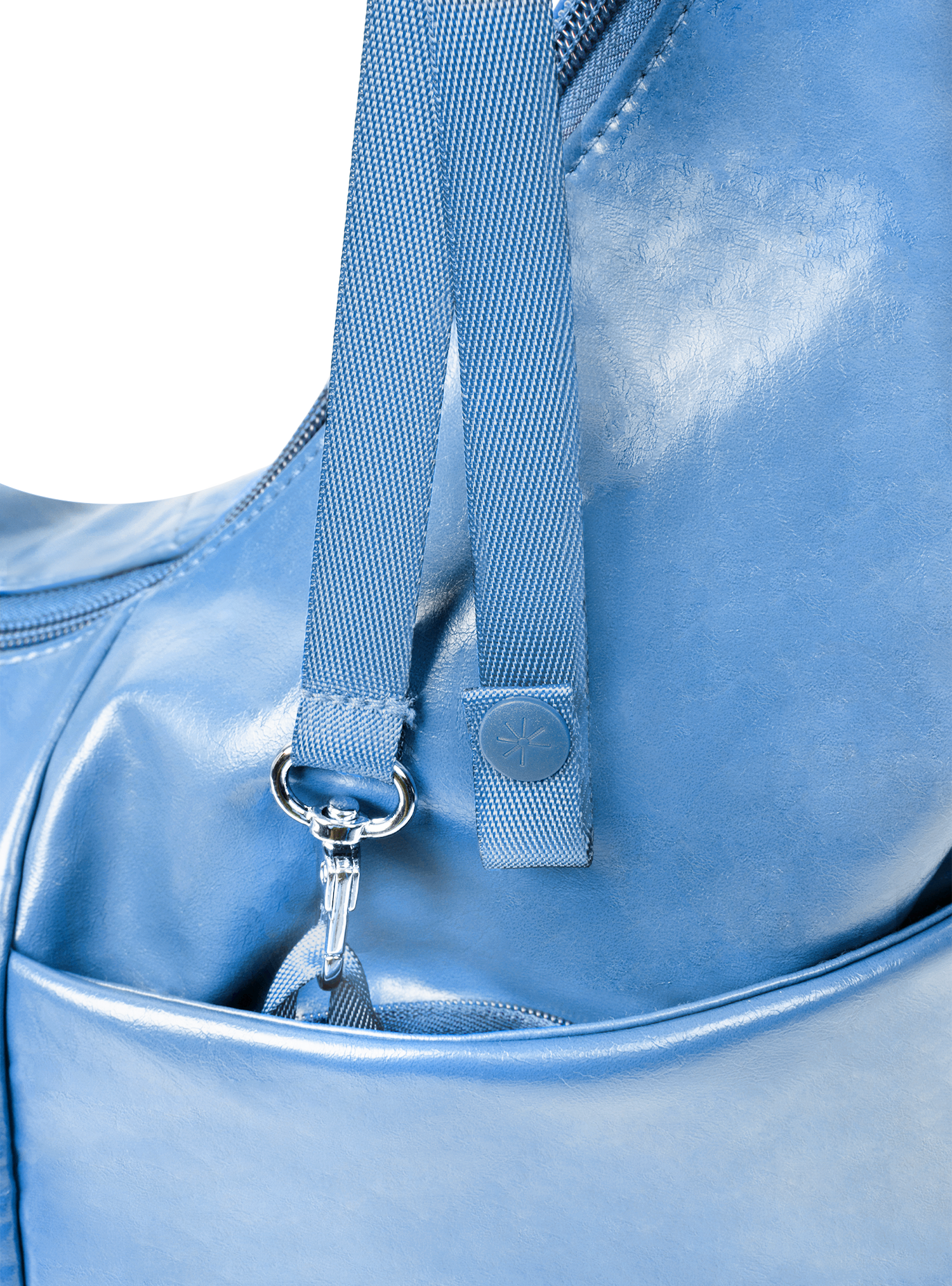 Exterior pocket of the Midi Arc hobo-style bag in island blue vegan leather, with concealed snap loop