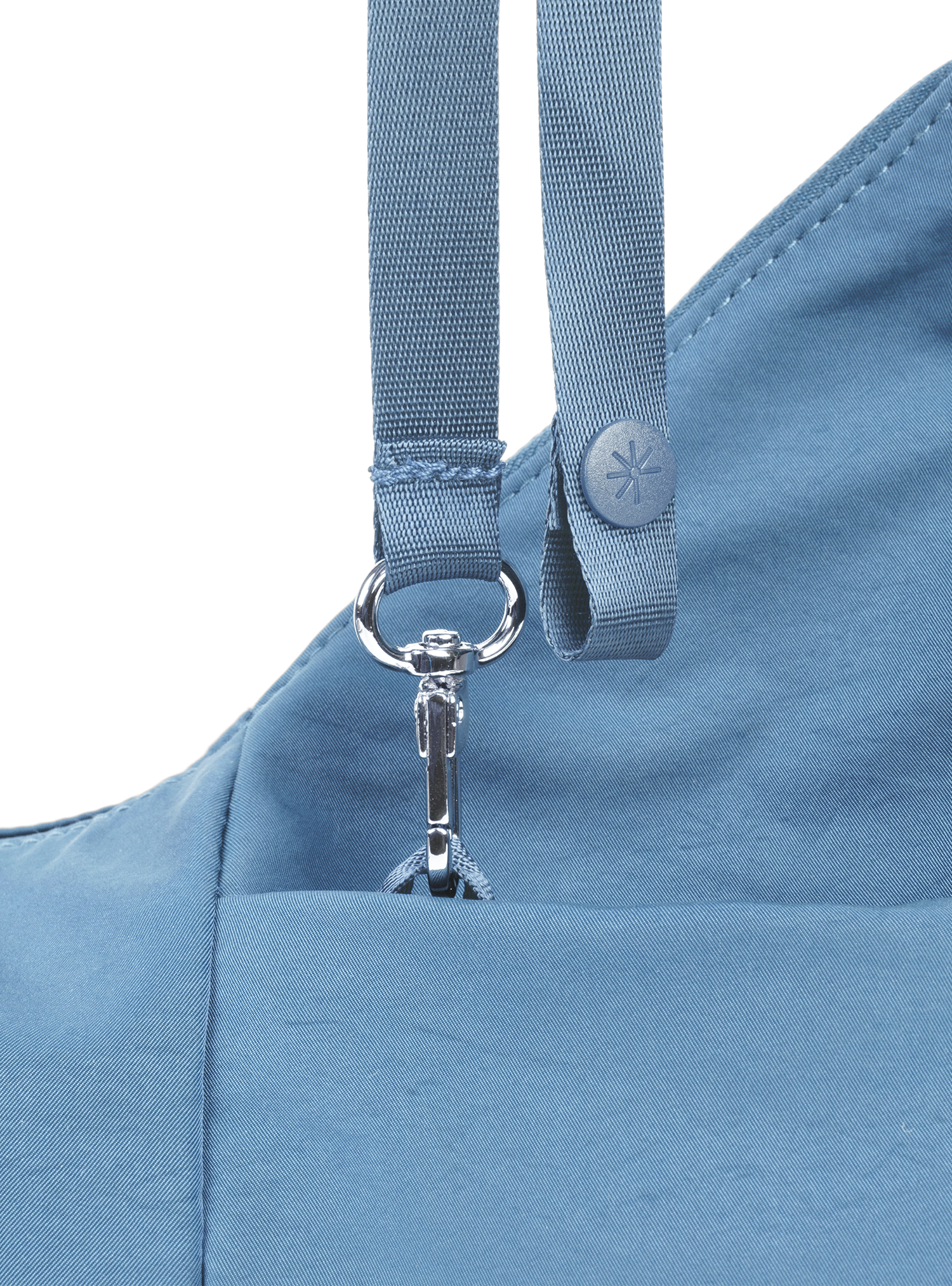 Exterior pocket of the Mini Arc hobo-style shoulder bag in grey blue nylon, with concealed snap loop