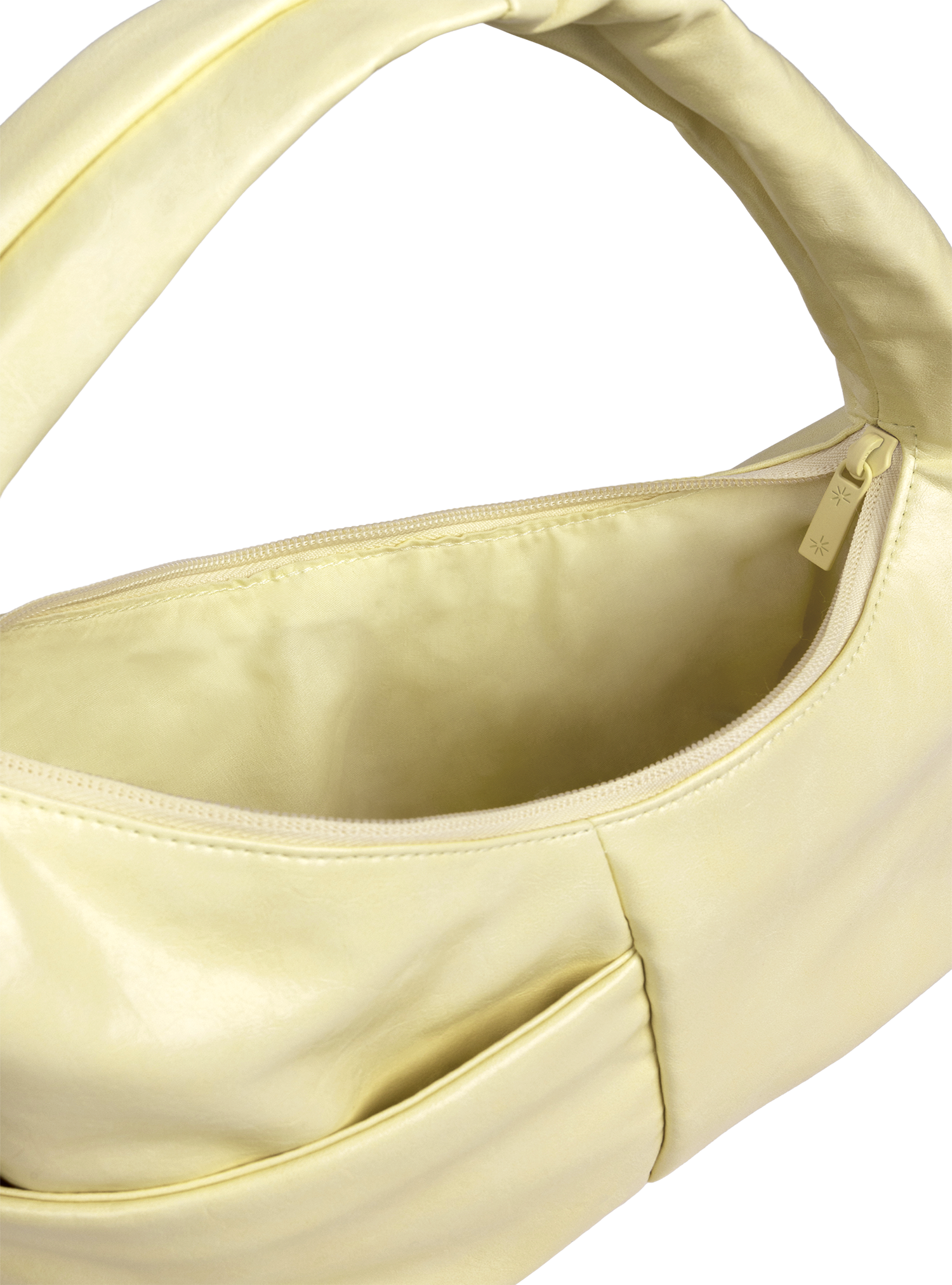 Interior of the Mini Arc hobo-style shoulder bag in creamy yellow vegan leather, with multiple pockets