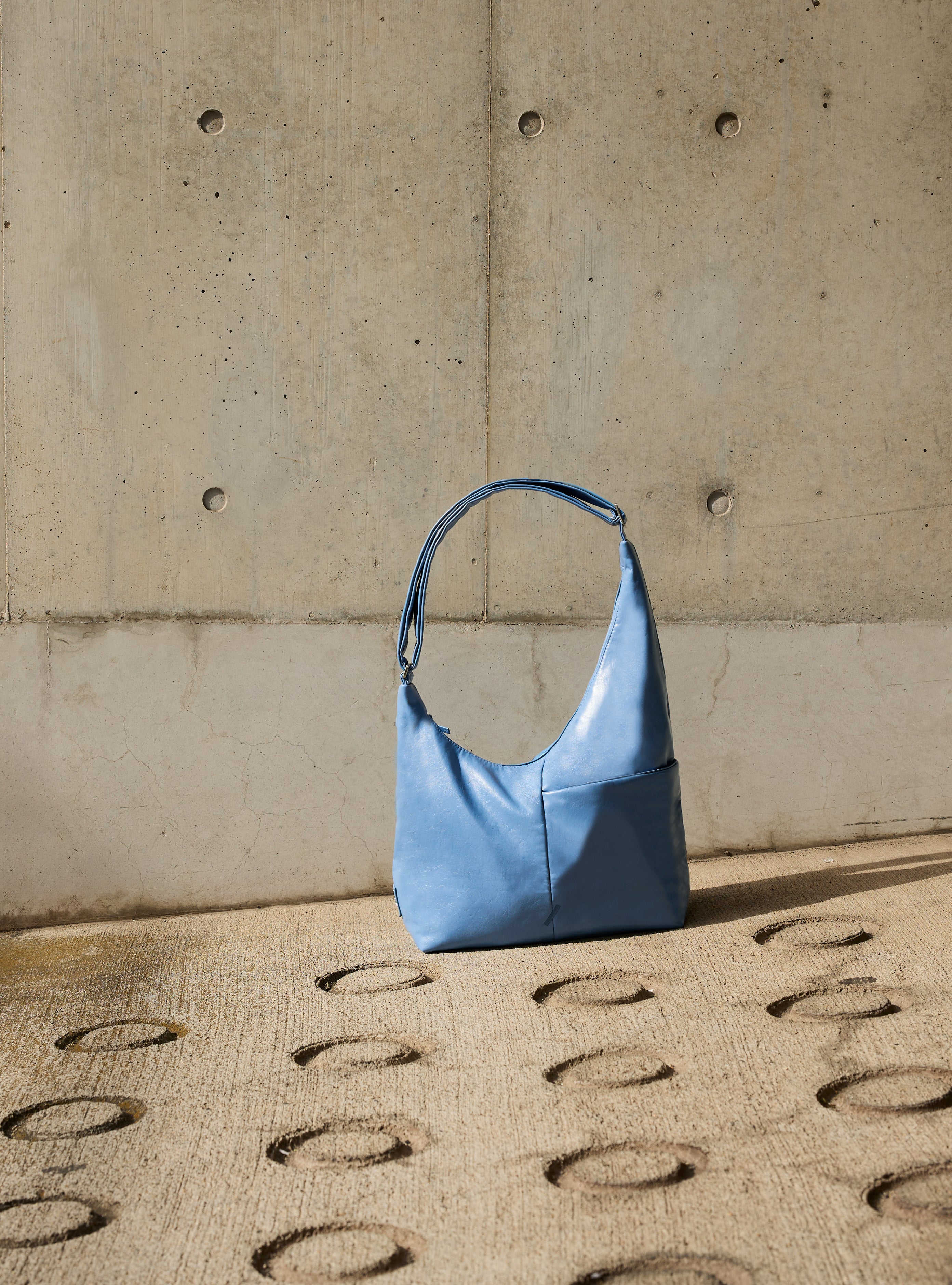 The Midi Arc slouchy hobo bag in island blue vegan leather for work, travel and everyday use