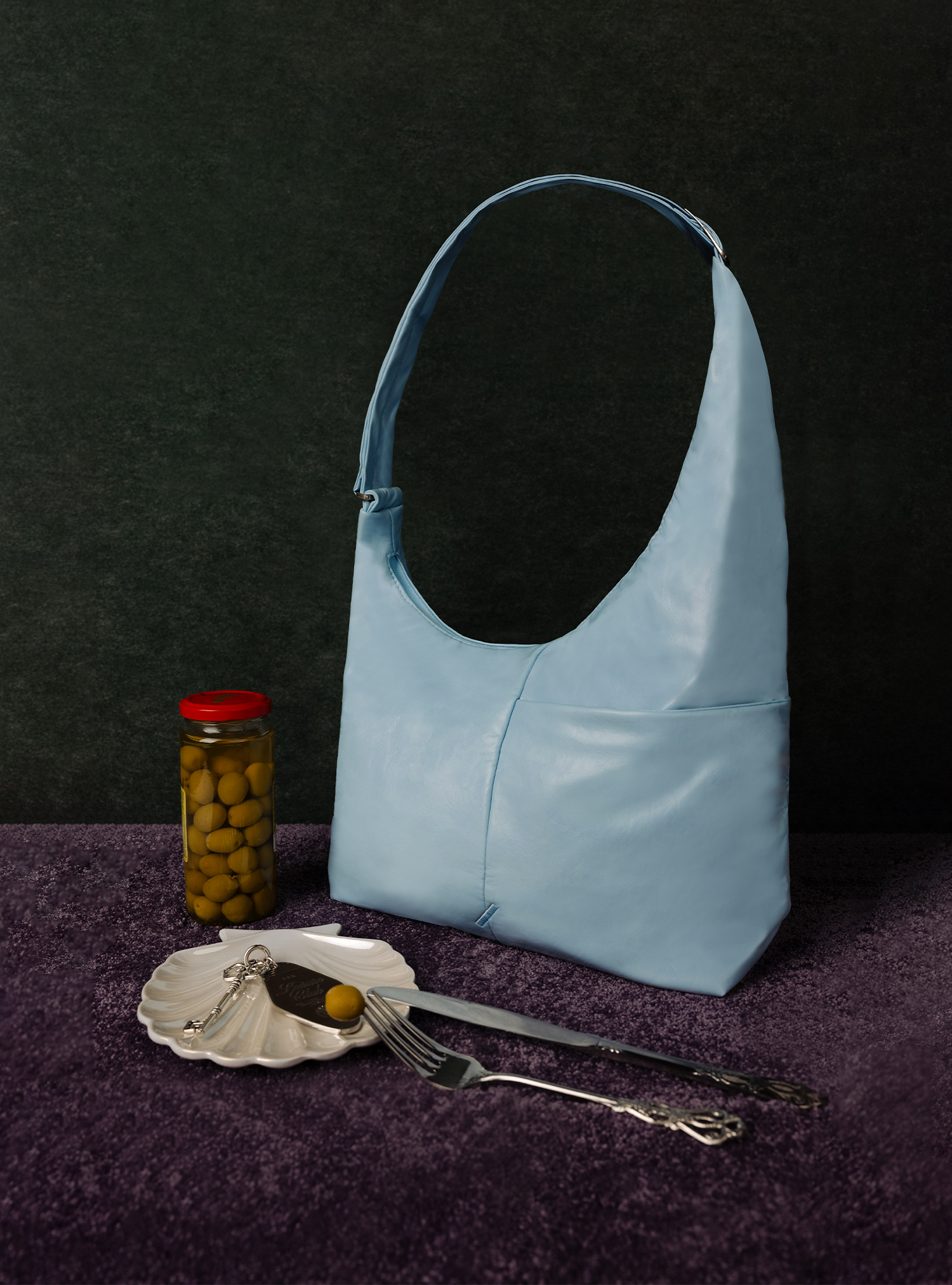 The Midi Arc slouchy hobo bag in pale blue vegan leather for work, travel and everyday use