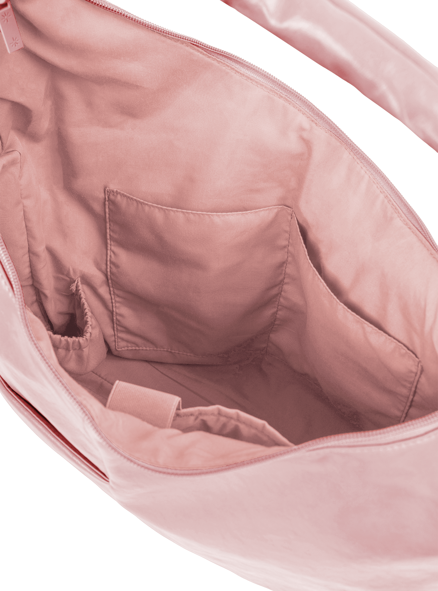 Interior of the Arc hobo-style bag in pale pink vegan leather, with multiple pockets and a bottle holder