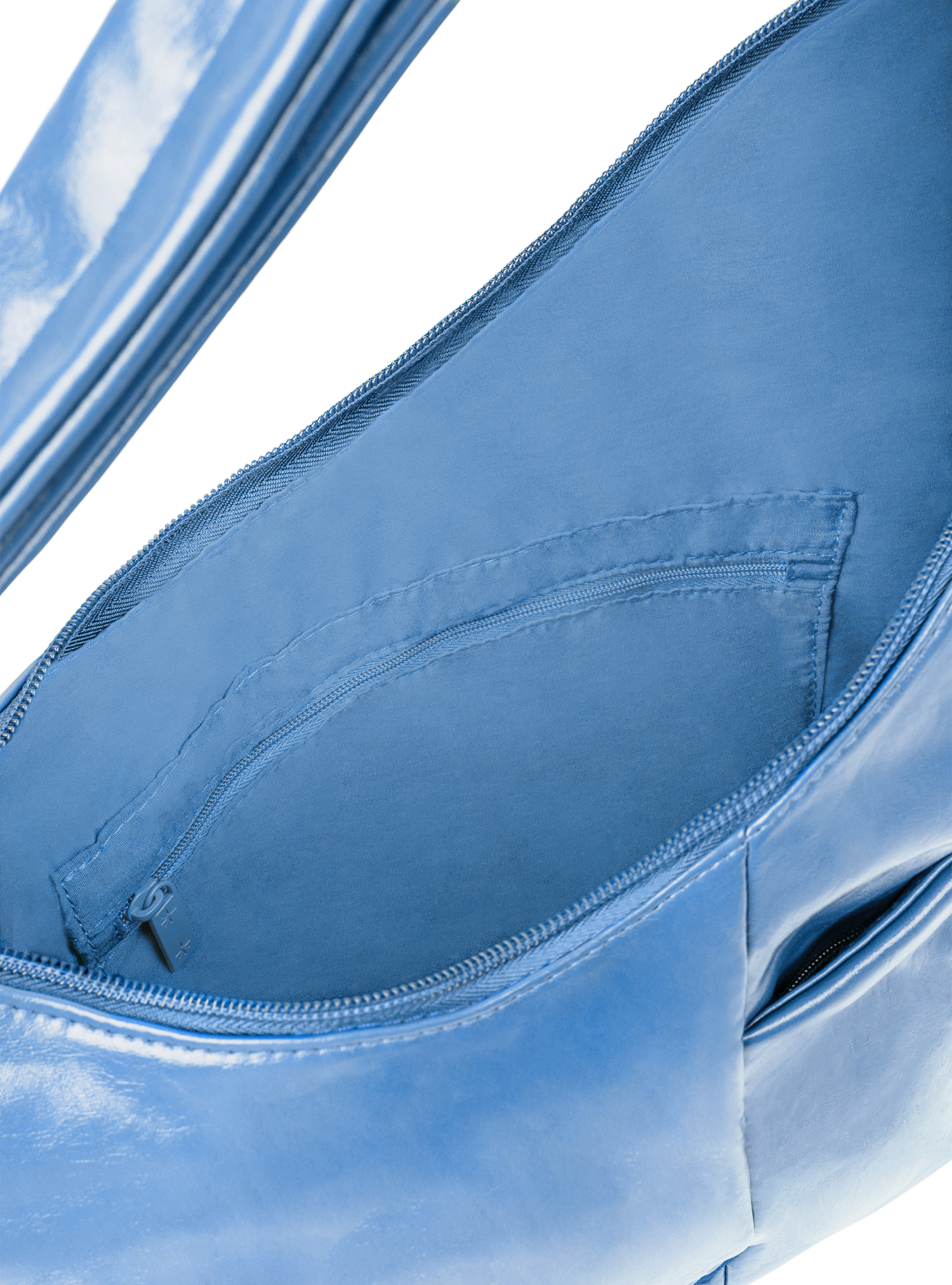 Interior of the Midi Arc hobo-style bag in island blue vegan leather, with multiple pockets