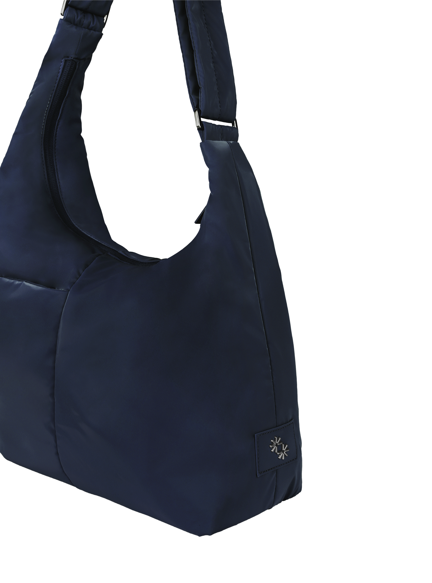 Close-up of the Midi Arc hobo-style bag in dark navy polyester, showing metal logo emblem