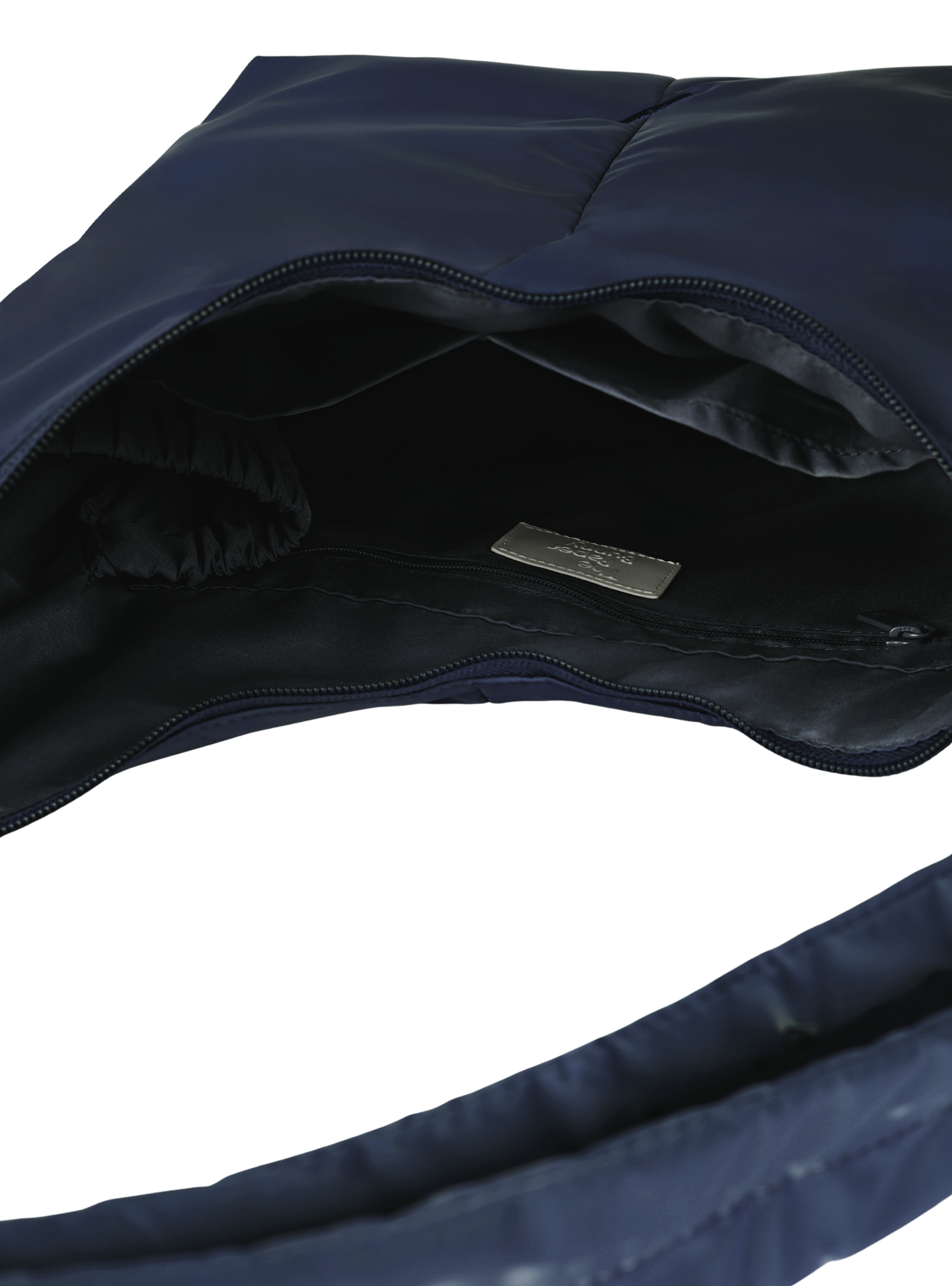 Interior of the Midi Arc hobo-style bag in dark navy polyester, with multiple pockets and a bottle holder