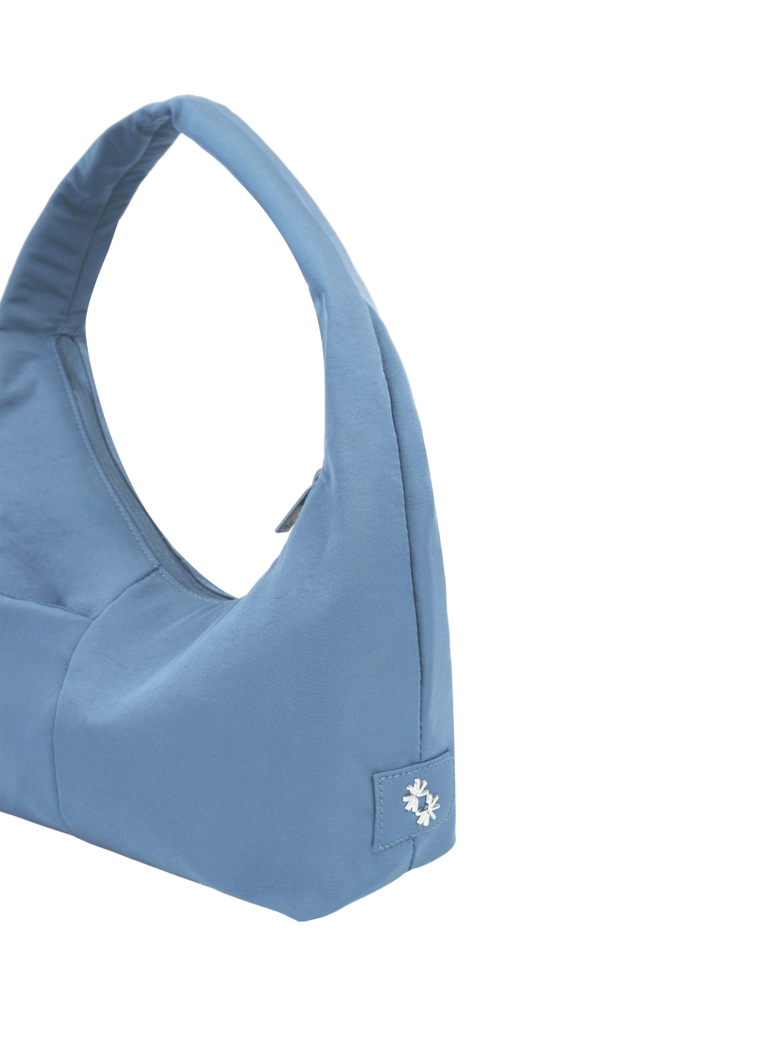 Close-up of the Mini Arc hobo-style shoulder bag in grey blue nylon, showing metal logo emblem